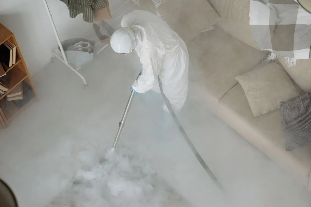 Biohazard cleanup technician in protective equipment, Old Forge, PA